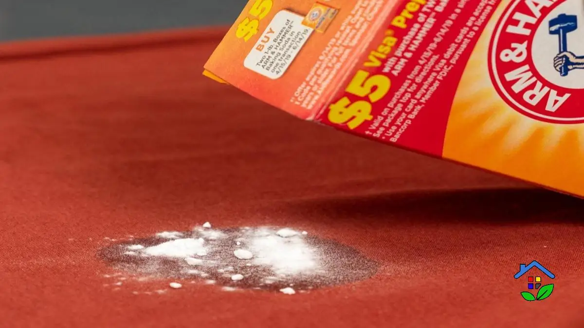 Remove the discoloration caused by a baking soda stain on clothes
